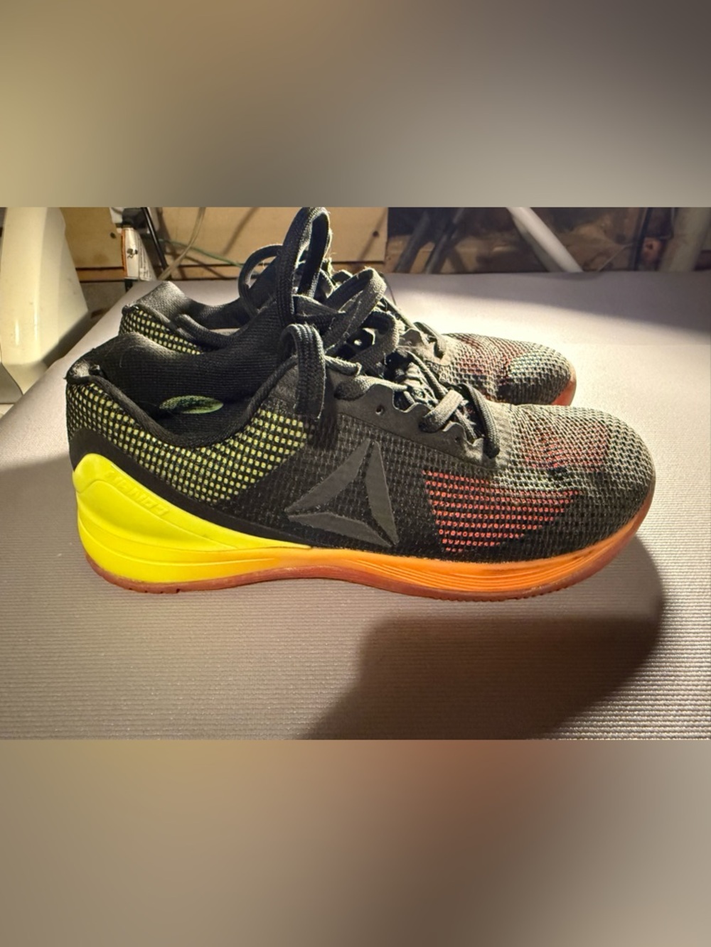 Reebok Men's Black Training Shoes with Yellow and Orange Accents